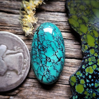 Qingu Spiderweb Turquoise Oval Cabochon